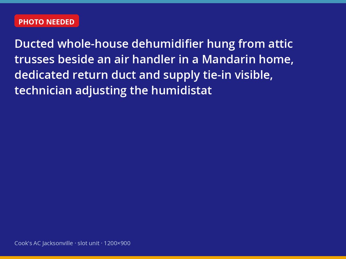 Technician setting the humidistat on a ducted whole-house dehumidifier in a Jacksonville attic